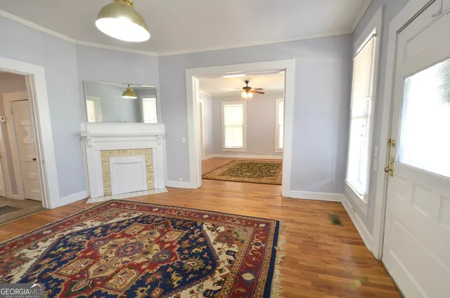 wooden floor in an empty room and a mirror