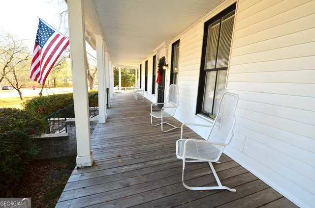 a view of living room with wooden floor and chair