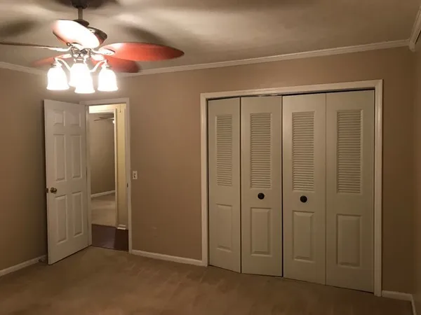 wooden floor in an empty room with a mirror