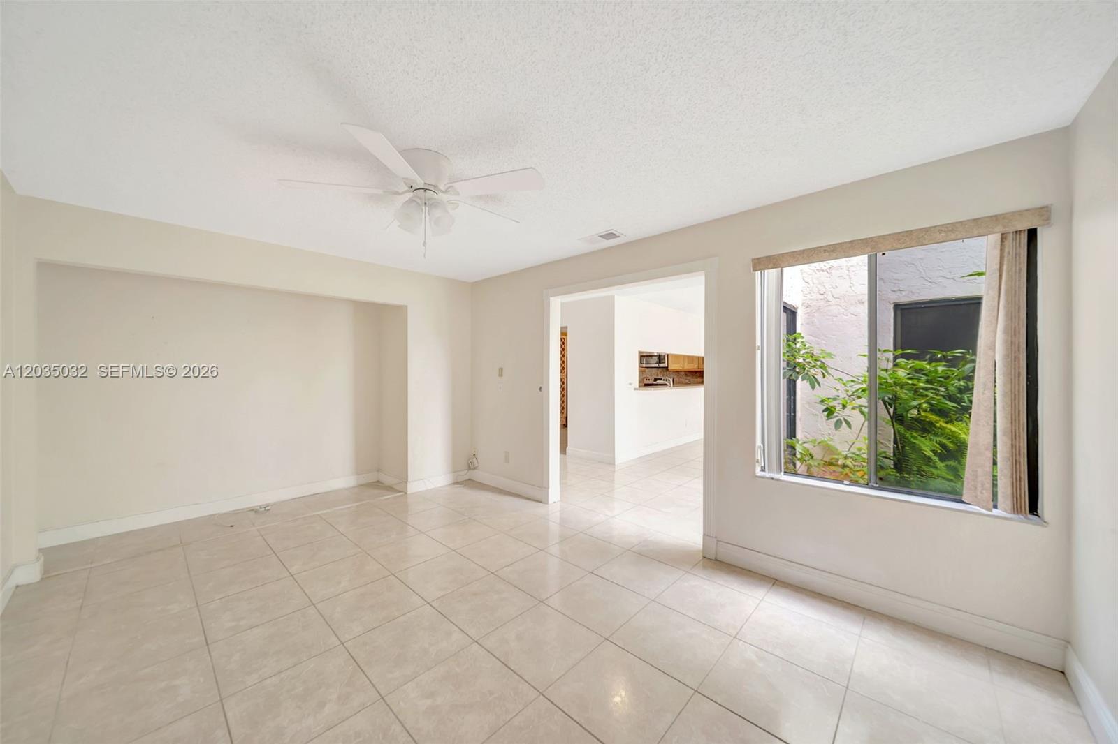 5223 Gate Lake Road, Unit 5223 Tamarac, FL 33319 - Photo 8 of 37 an empty room with windows and closet