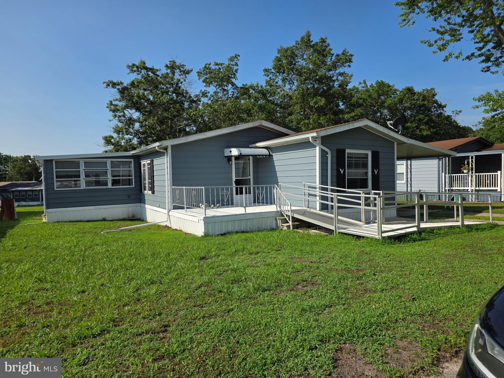 7 Barbara Lane Barnegat, NJ 08005 - Photo 1 of 25 a front view of house with yard and outdoor seating