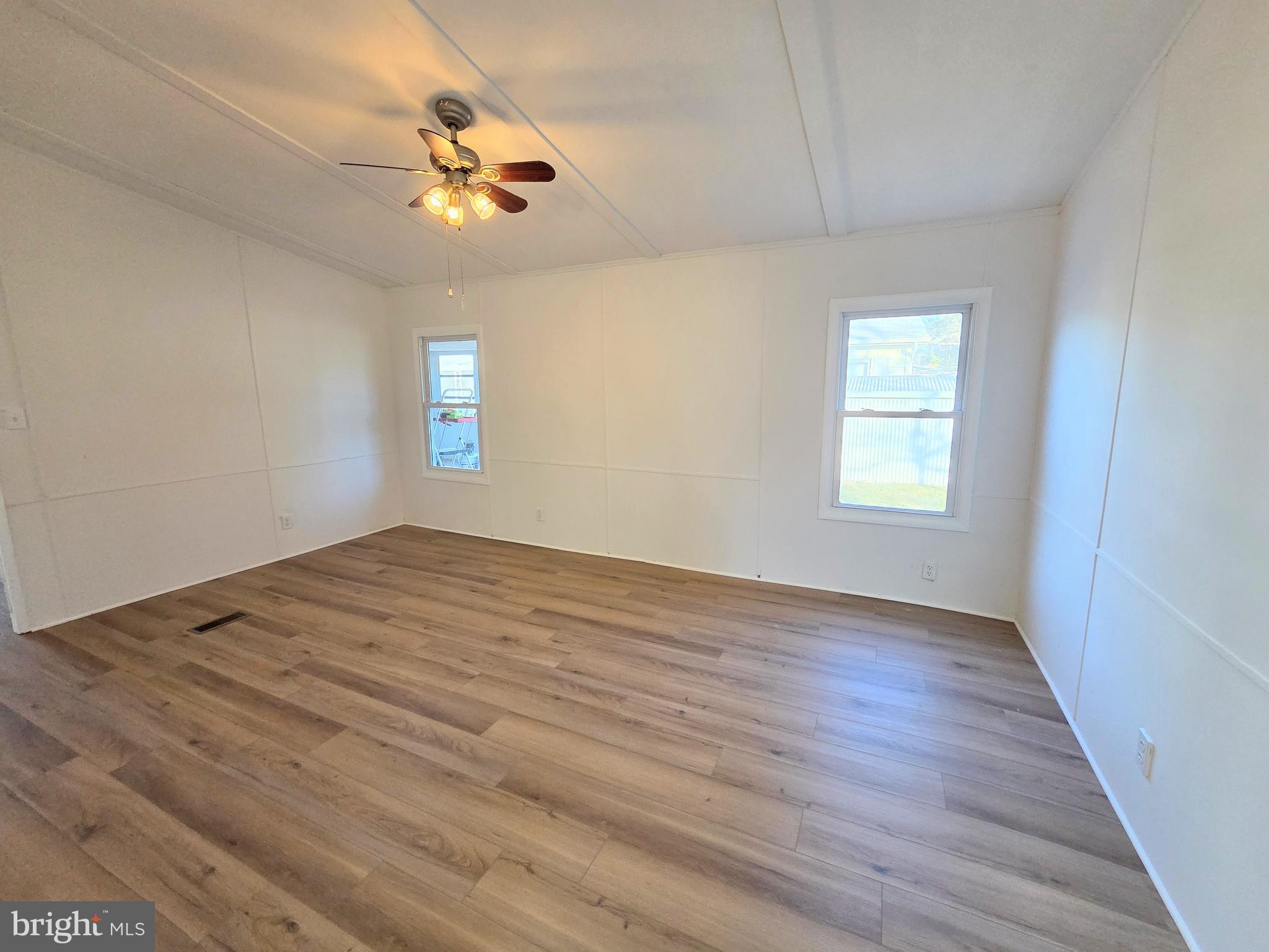 7 Barbara Lane Barnegat, NJ 08005 - Photo 11 of 25 wooden floor in an empty room with a window