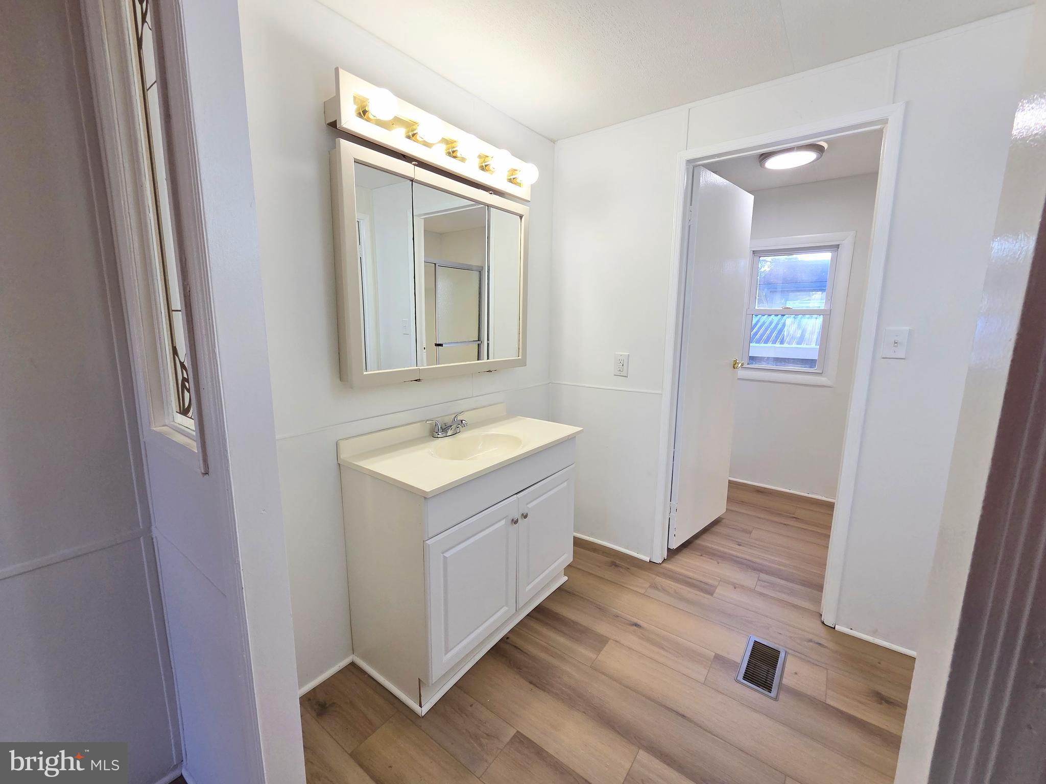 7 Barbara Lane Barnegat, NJ 08005 - Photo 14 of 25 a spacious bathroom with a vanity and a mirror
