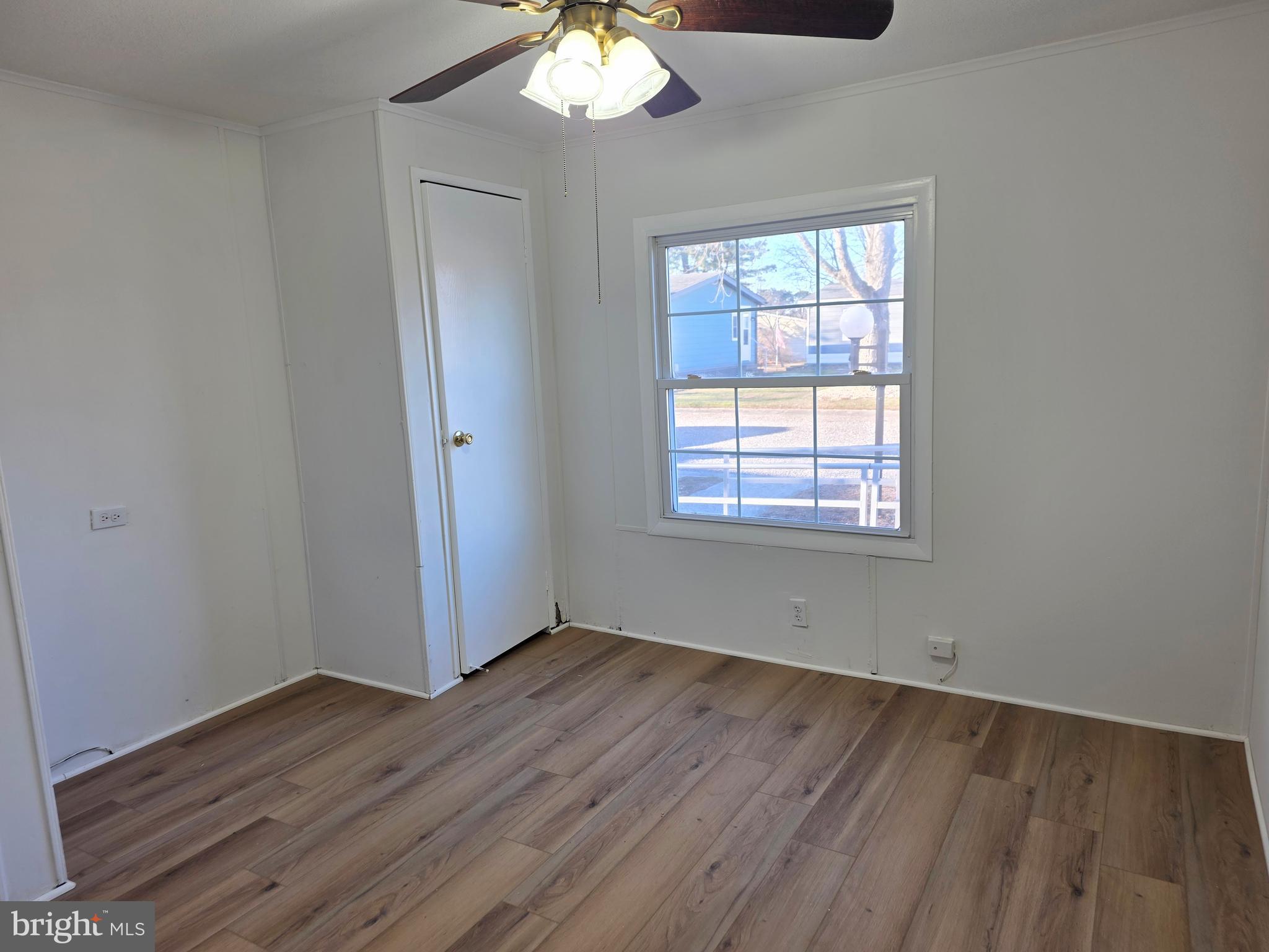 7 Barbara Lane Barnegat, NJ 08005 - Photo 18 of 25 a view of an empty room with wooden floor and a window