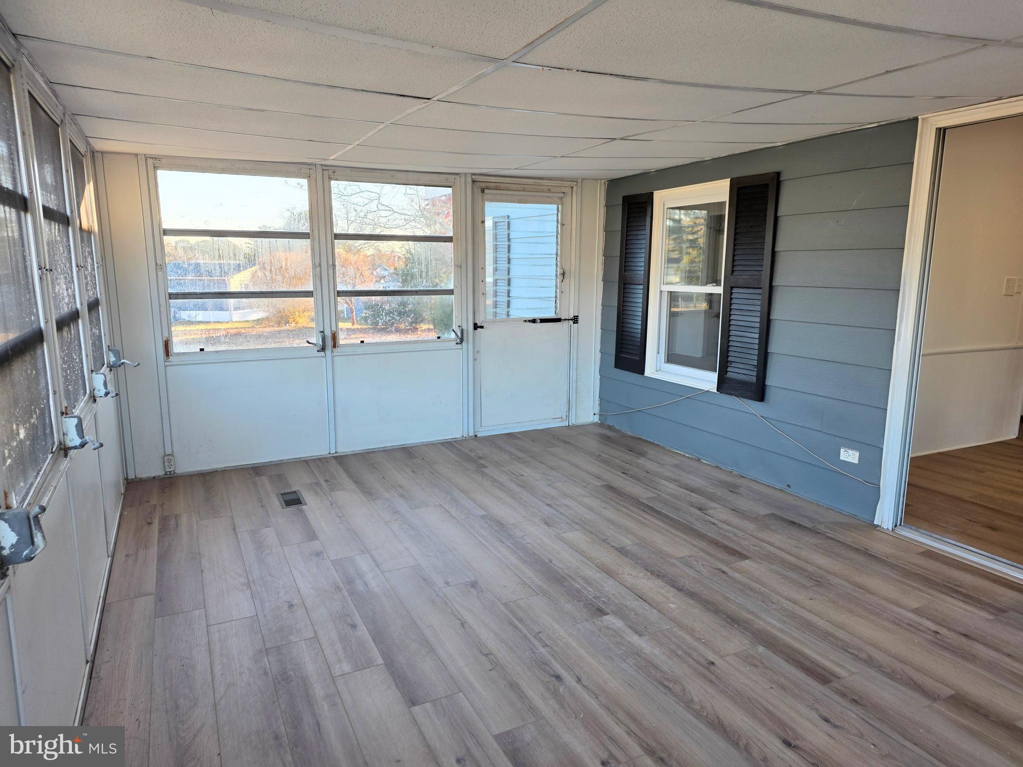 7 Barbara Lane Barnegat, NJ 08005 - Photo 22 of 25 an empty room with wooden floor and windows