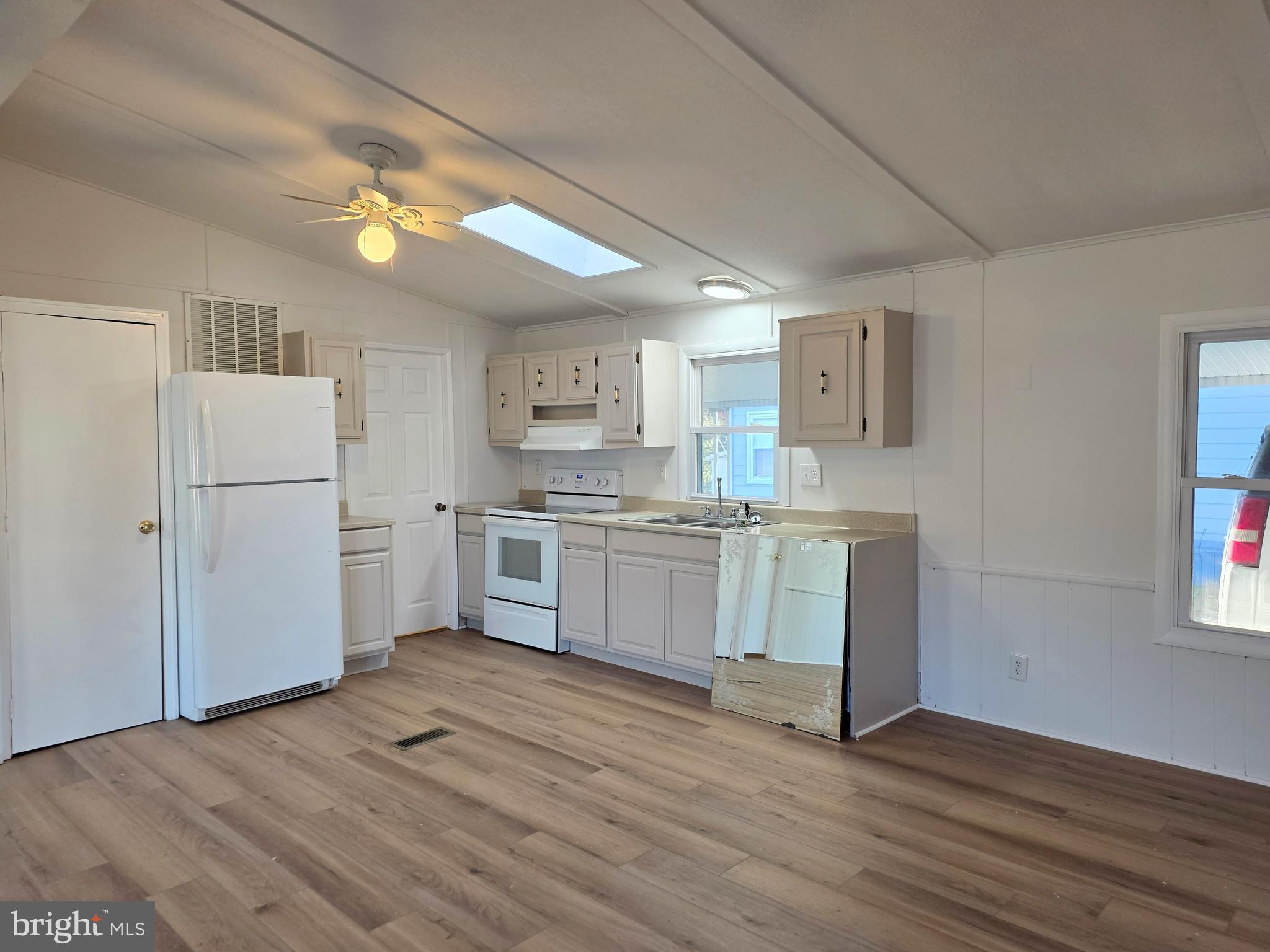 7 Barbara Lane Barnegat, NJ 08005 - Photo 5 of 25 a kitchen with white cabinets and white appliances