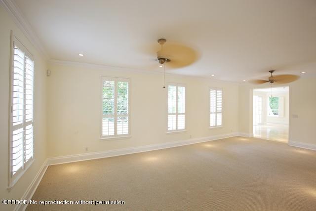 112 Caribbean Road Palm Beach, FL 33480 - Photo 4 of 6 a view of an empty room with a window