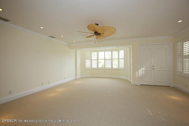 112 Caribbean Road Palm Beach, FL 33480 - Photo 5 of 6 a view of an empty room with a window