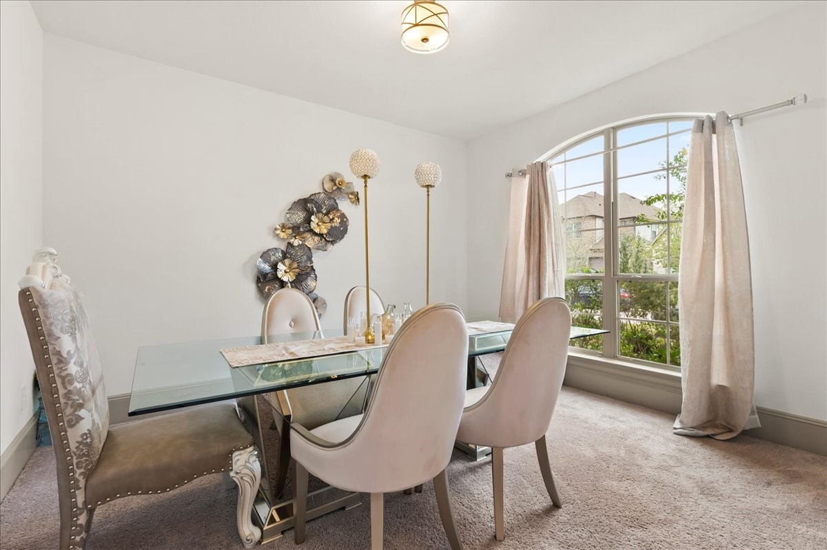 712 Fall Rock Branch Drive Conroe, TX 77304 - Photo 11 of 23 a dining room with furniture and window