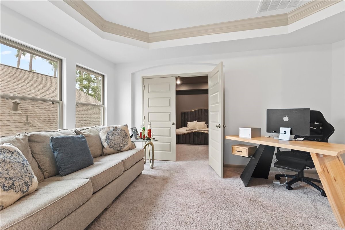 712 Fall Rock Branch Drive Conroe, TX 77304 - Photo 16 of 23 a living room with furniture and a window