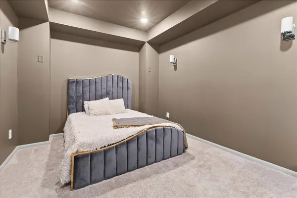 a bedroom with a bed and a table
