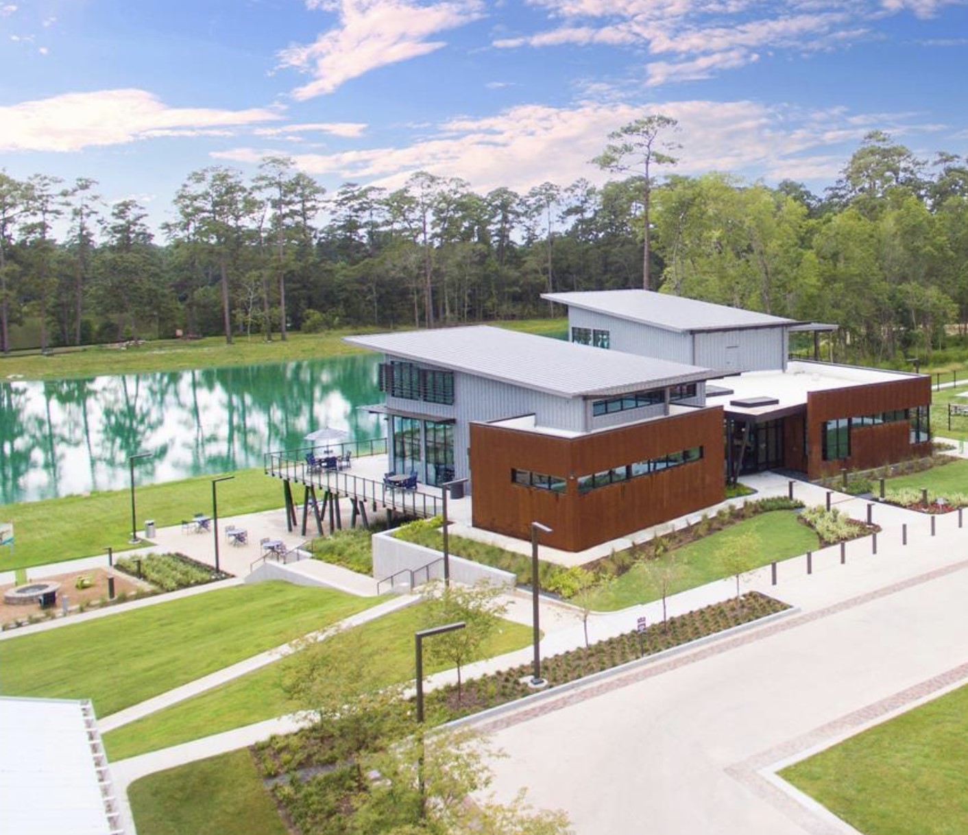 712 Fall Rock Branch Drive Conroe, TX 77304 - Photo 20 of 23 an aerial view of a house with a garden and a car park side of the road