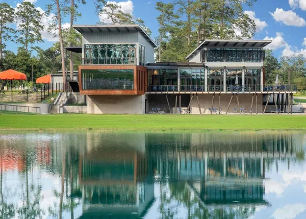 a view of a lake with a building in the background