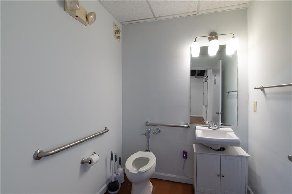 5300 Peachtree Road, Unit 1306 Chamblee, GA 30341 - Photo 7 of 7 a bathroom with a sink mirror and toilet