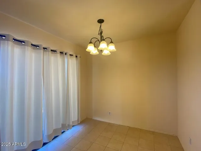 a bathroom with a mirror and a shower curtain