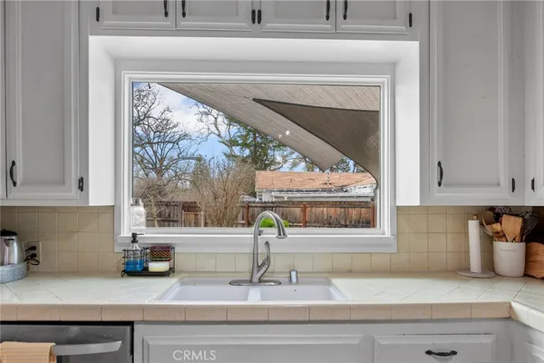 a kitchen with a sink and a window
