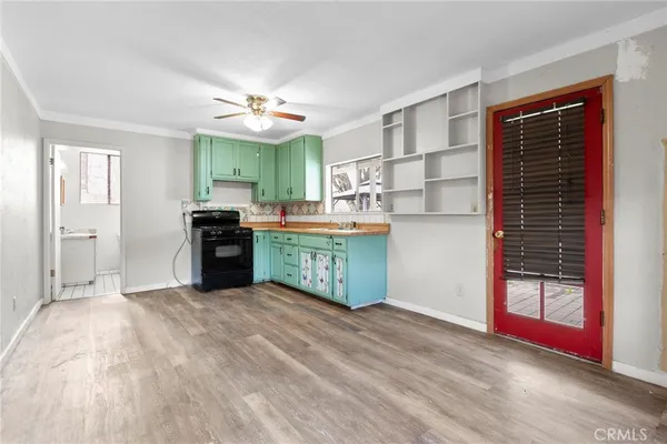a kitchen with stainless steel appliances granite countertop a stove and a sink