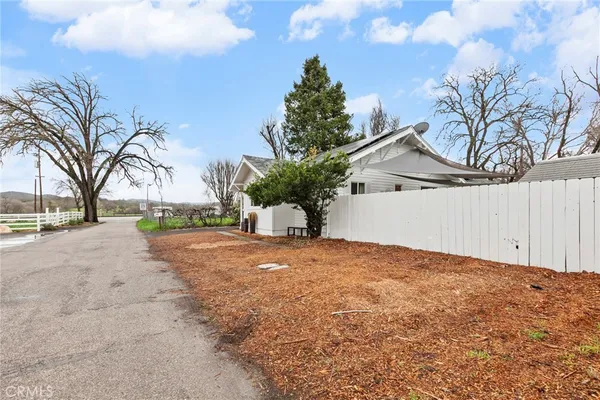 a view of a house with a yard and garage
