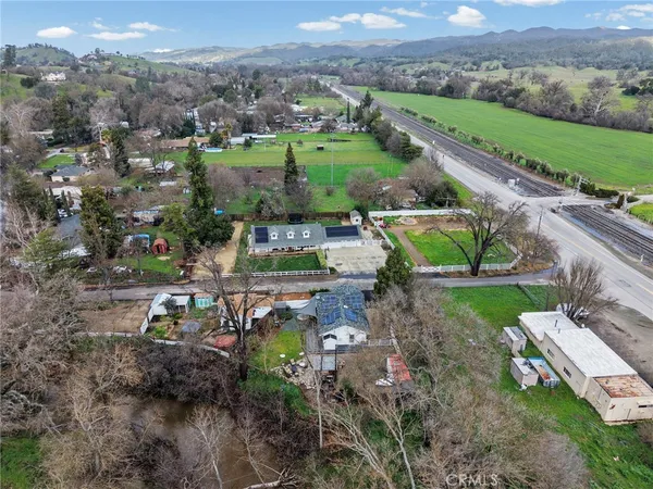 an aerial view of a house with outdoor space