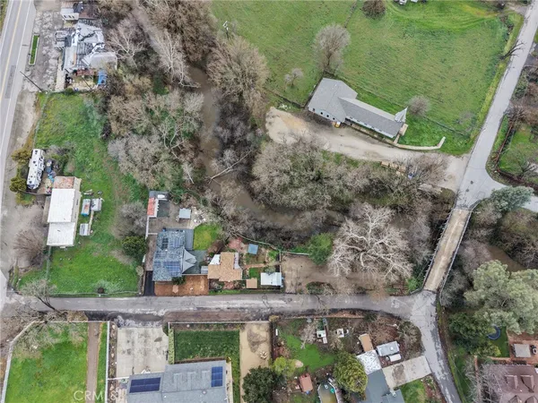 an aerial view of a house with outdoor space