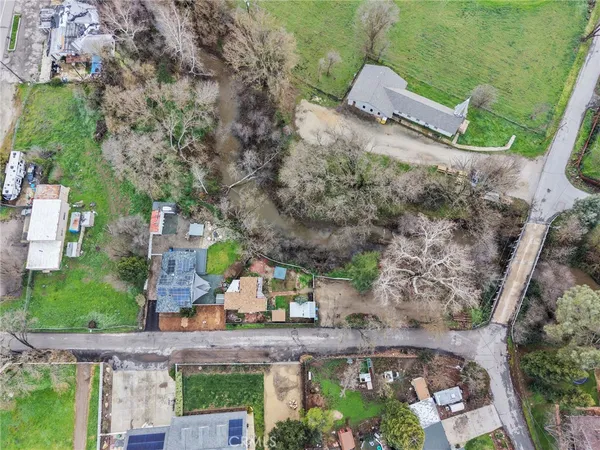 an aerial view of a house with outdoor space