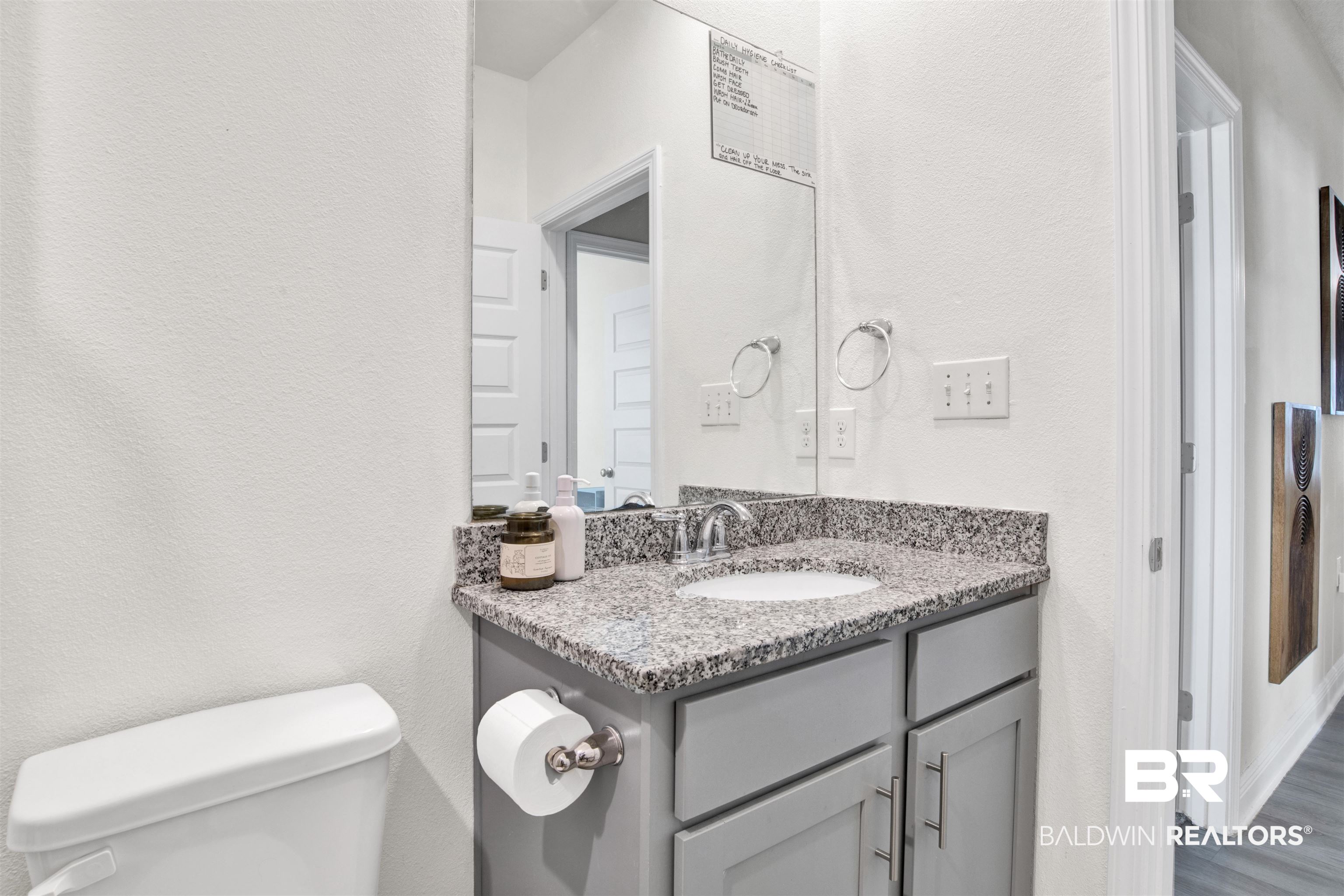 24253 Alydar Loop Daphne, AL 36526 - Photo 23 of 44 Bathroom with a textured wall and vanity