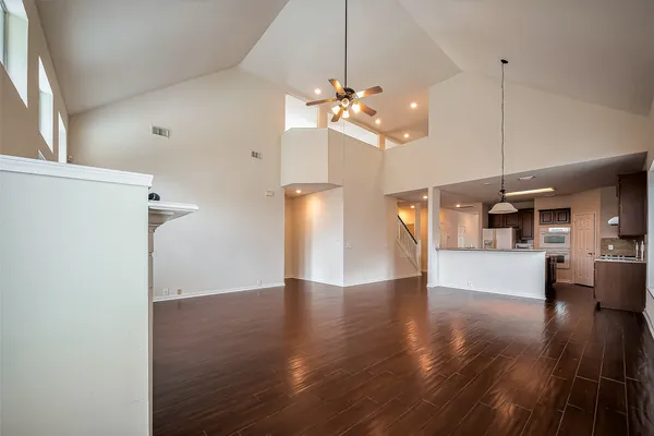 a view of an entryway with wooden floor