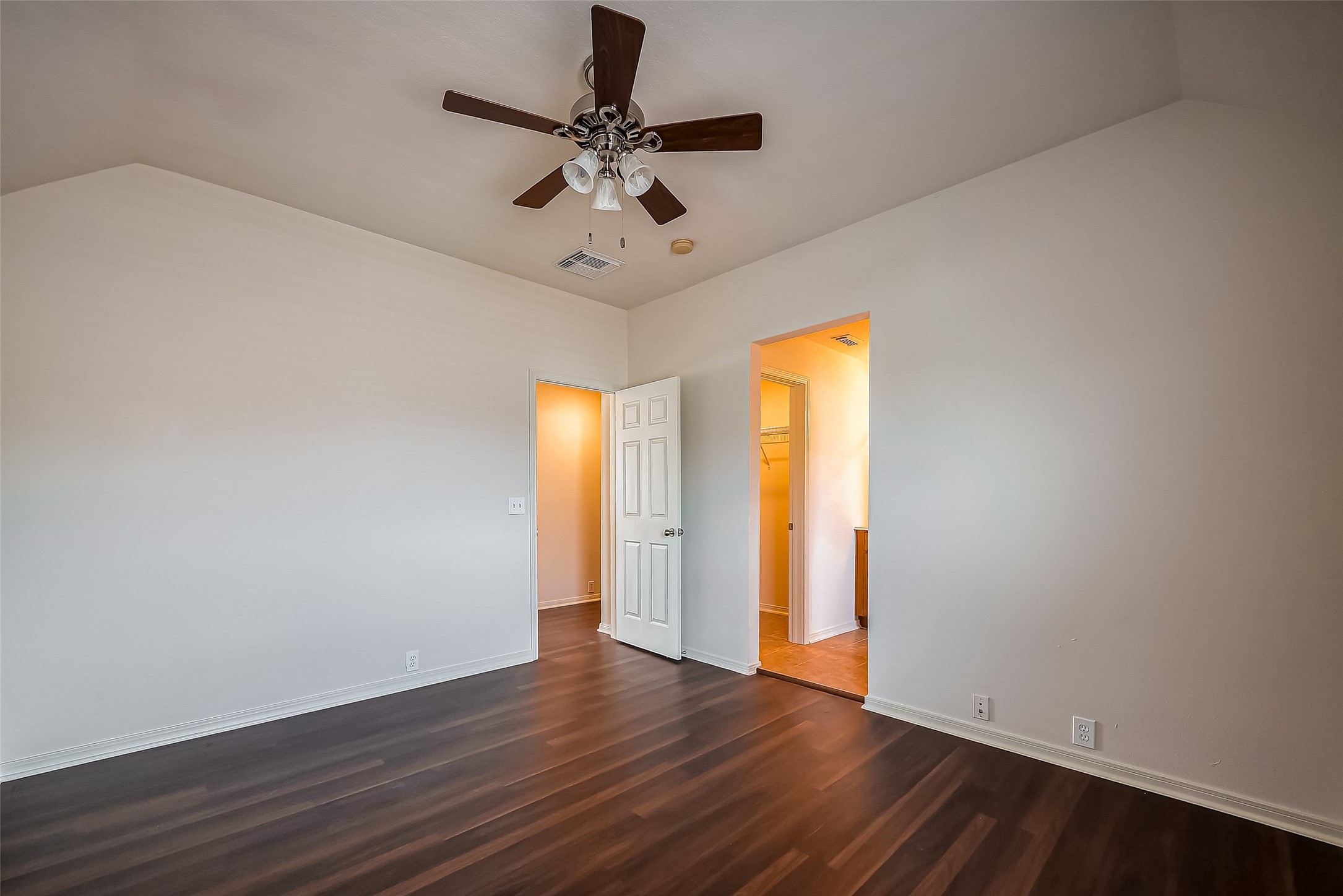 20006 Shavon Springs Drive Spring, TX 77388 - Photo 23 of 50 an empty room with wooden floor fan and windows