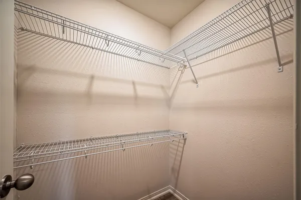 a view of a room with racks on the wall