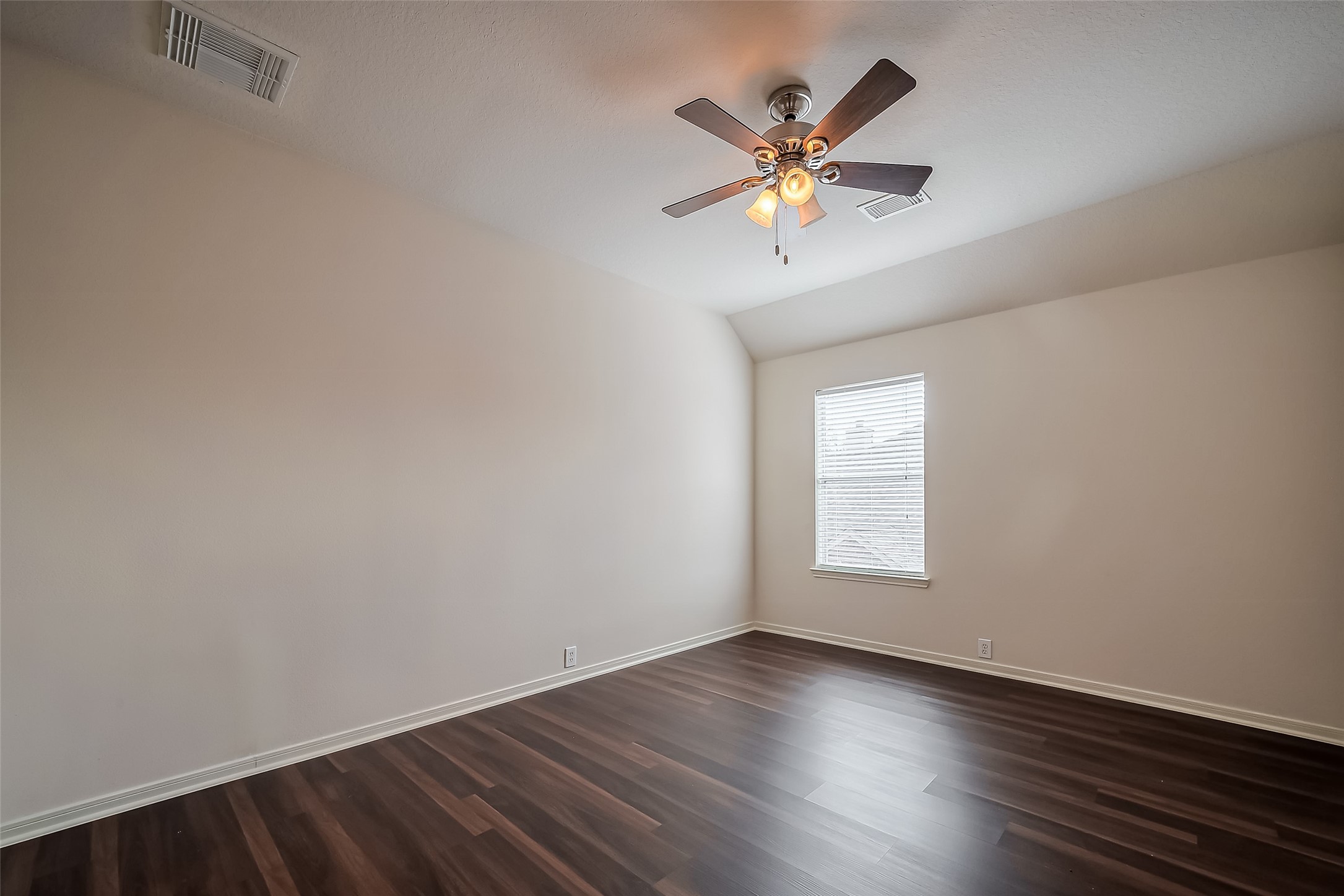 20006 Shavon Springs Drive Spring, TX 77388 - Photo 31 of 50 an empty room with wooden floor and windows