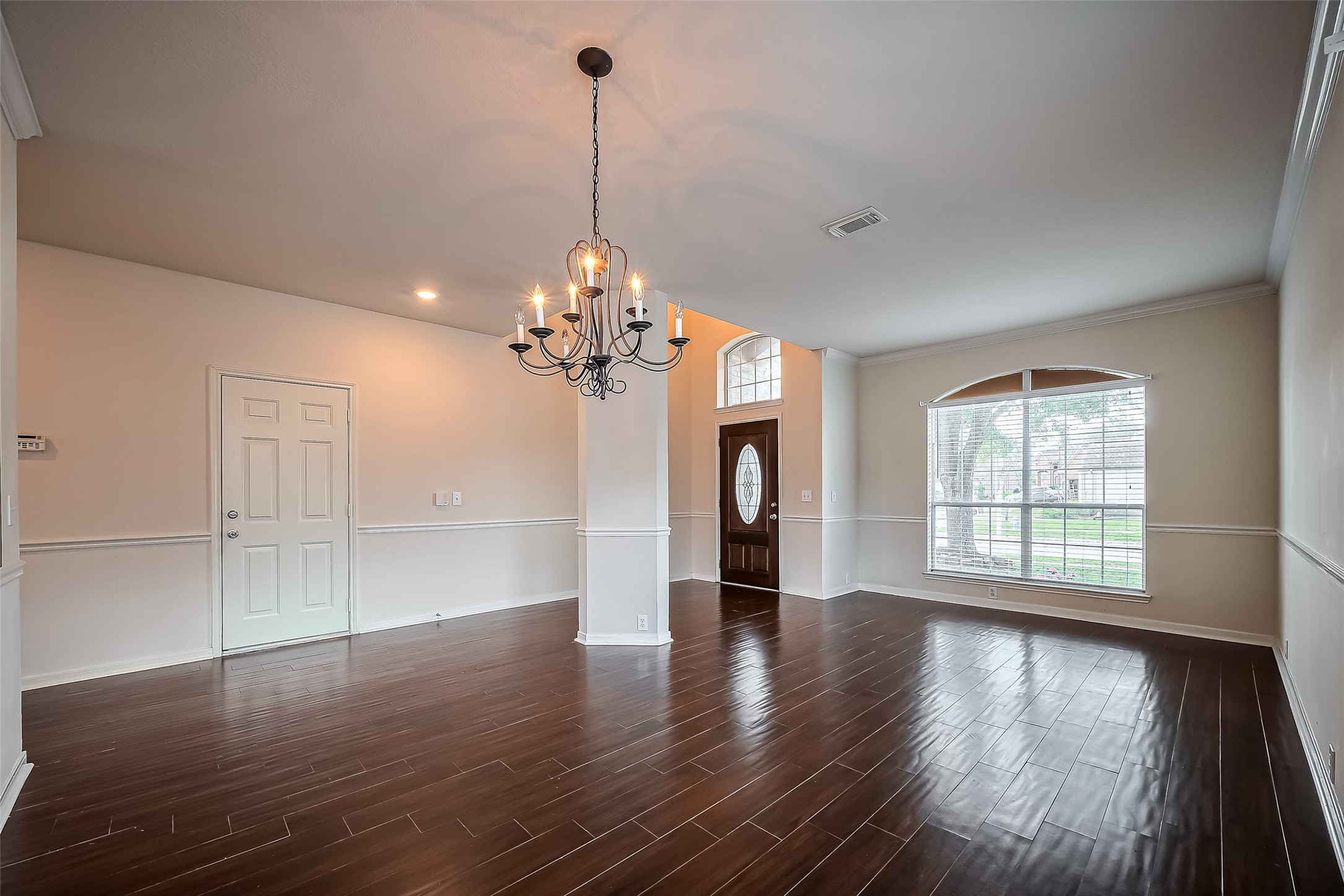 20006 Shavon Springs Drive Spring, TX 77388 - Photo 8 of 50 a view of an empty room with wooden floor and a window