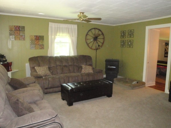 45 Shepard Road Sturbridge, MA 01566 - Photo 5 of 20 a living room with furniture a clock and a window