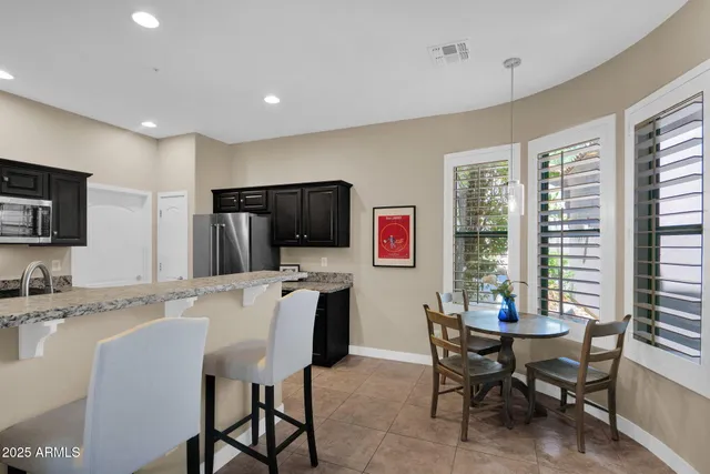 a view of a dining room with furniture window and outside view