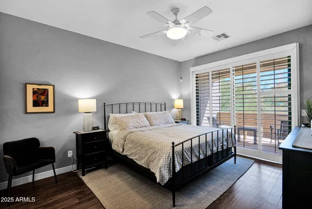 a bedroom with a bed and a couch