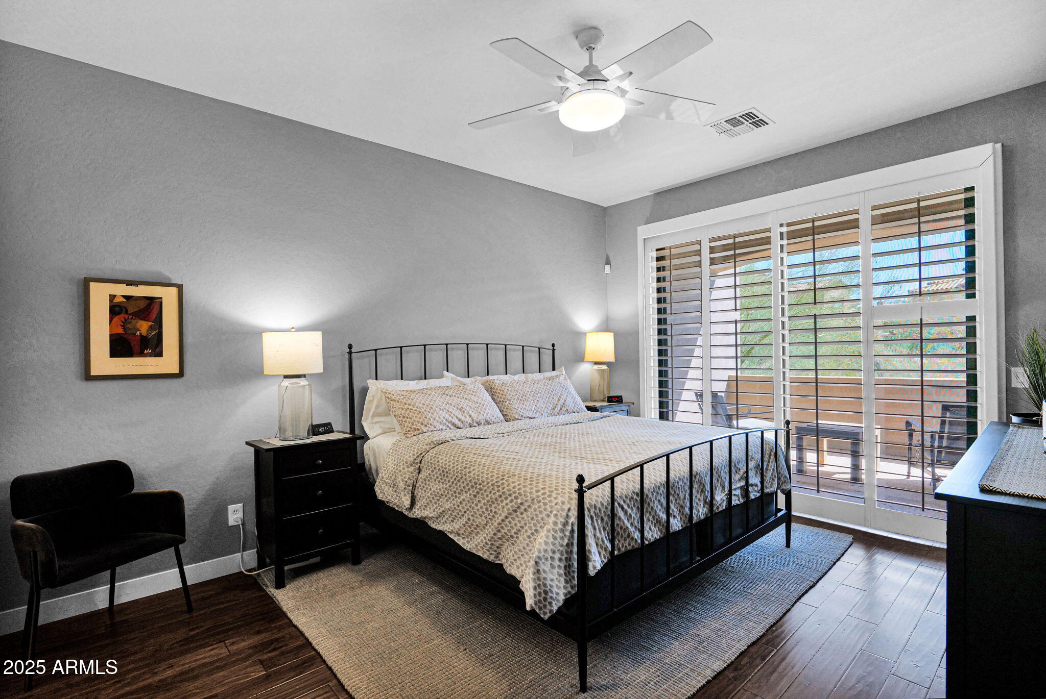 19550 North Grayhawk Drive, Unit 1063 Scottsdale, AZ 85255 - Photo 13 of 40 a bedroom with a bed and a couch