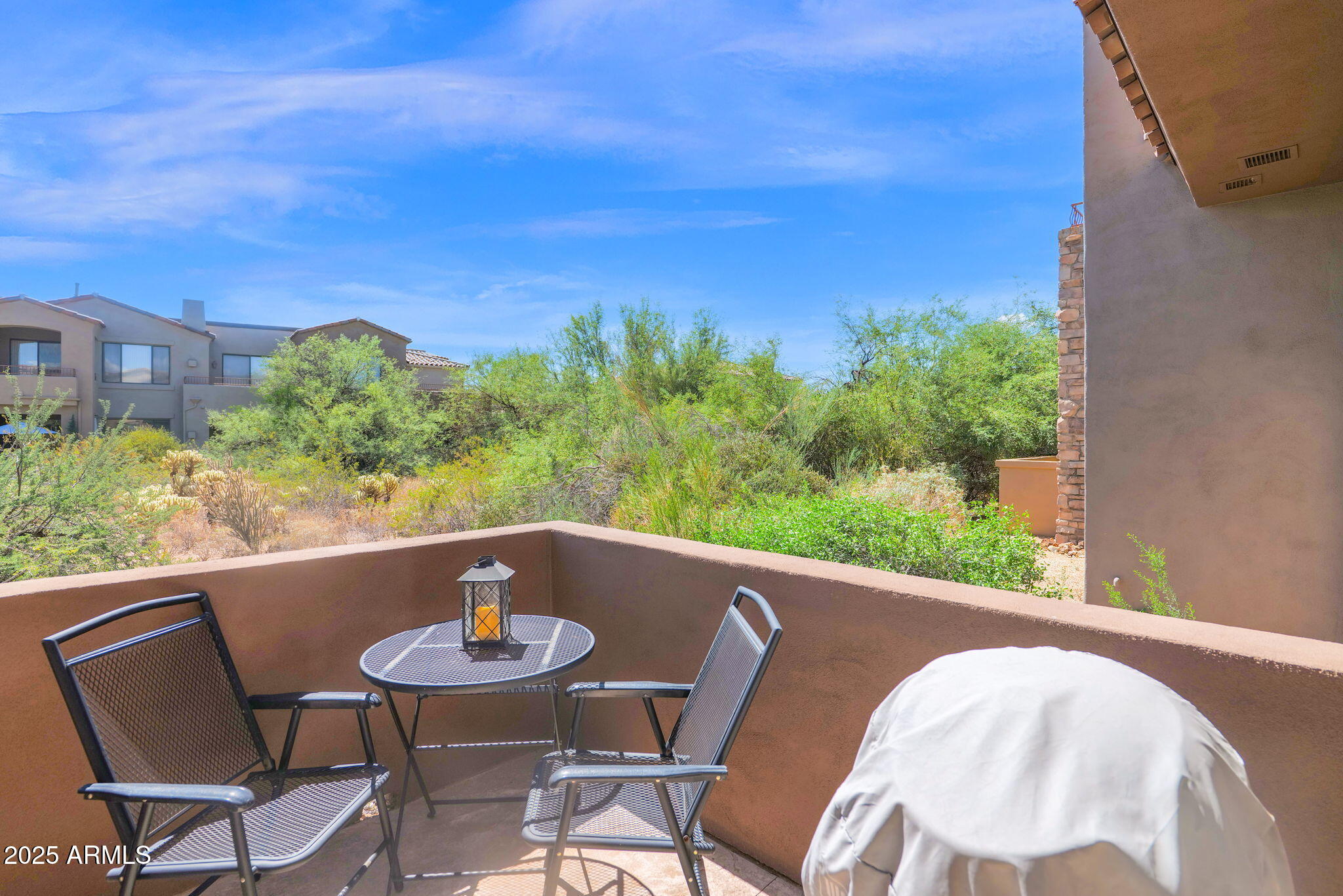 19550 North Grayhawk Drive, Unit 1063 Scottsdale, AZ 85255 - Photo 22 of 40 a view of a chairs and table in patio
