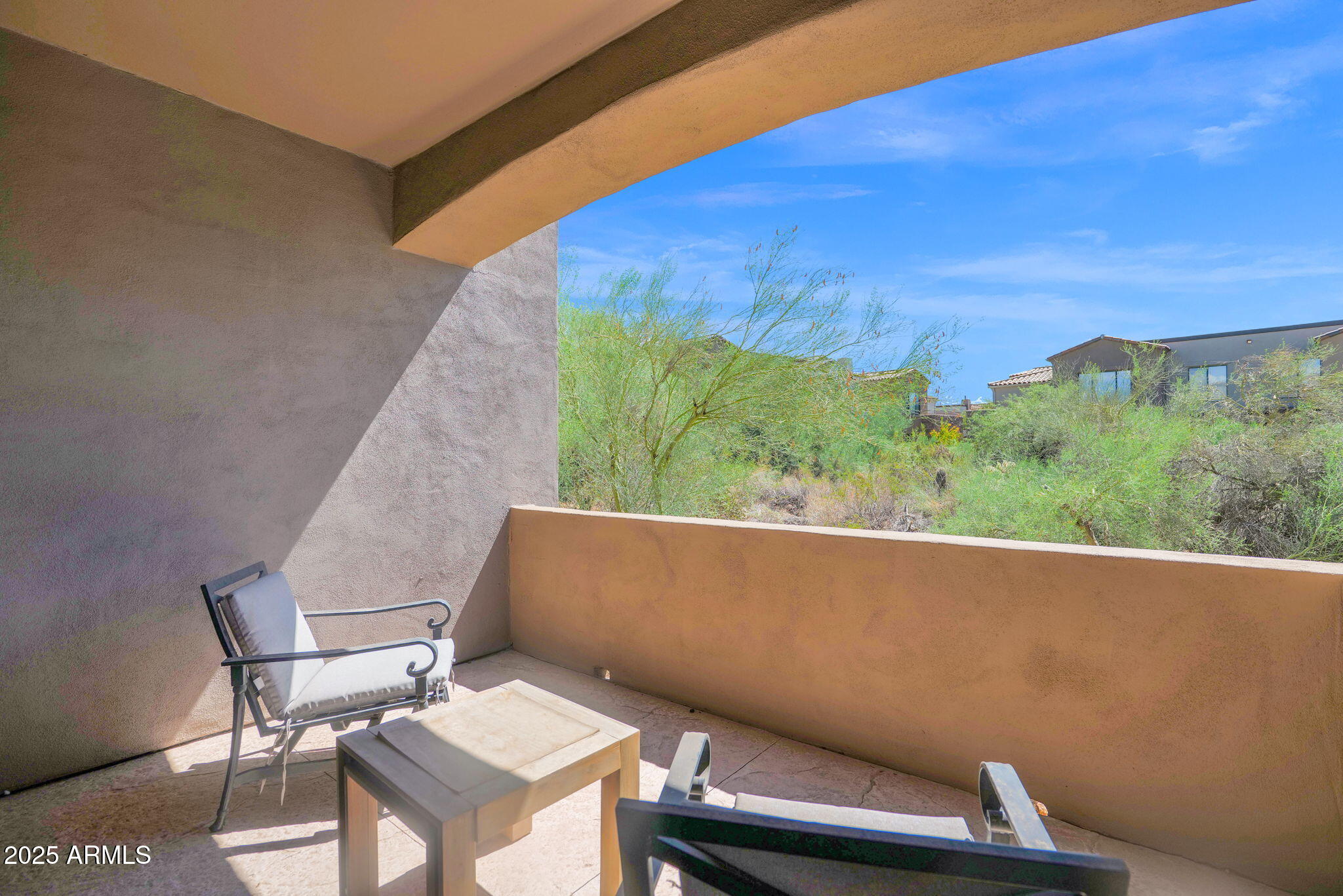 19550 North Grayhawk Drive, Unit 1063 Scottsdale, AZ 85255 - Photo 23 of 40 a view of a chairs and table in patio