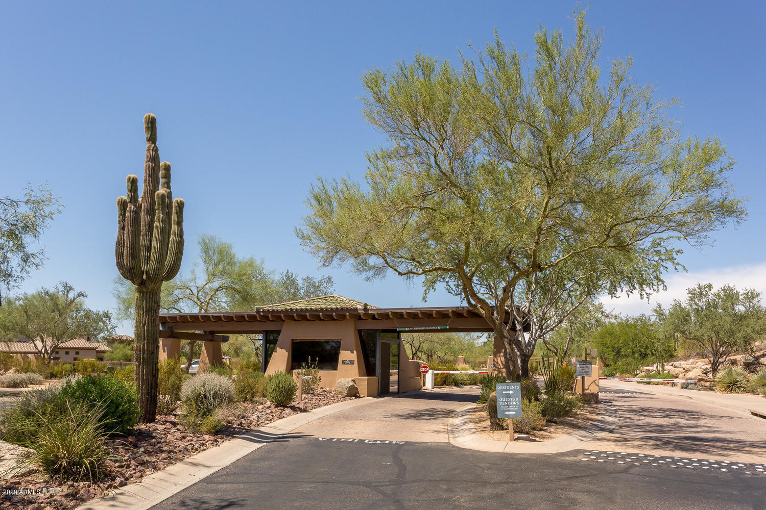 19550 North Grayhawk Drive, Unit 1063 Scottsdale, AZ 85255 - Photo 37 of 40 a front view of a house with garden