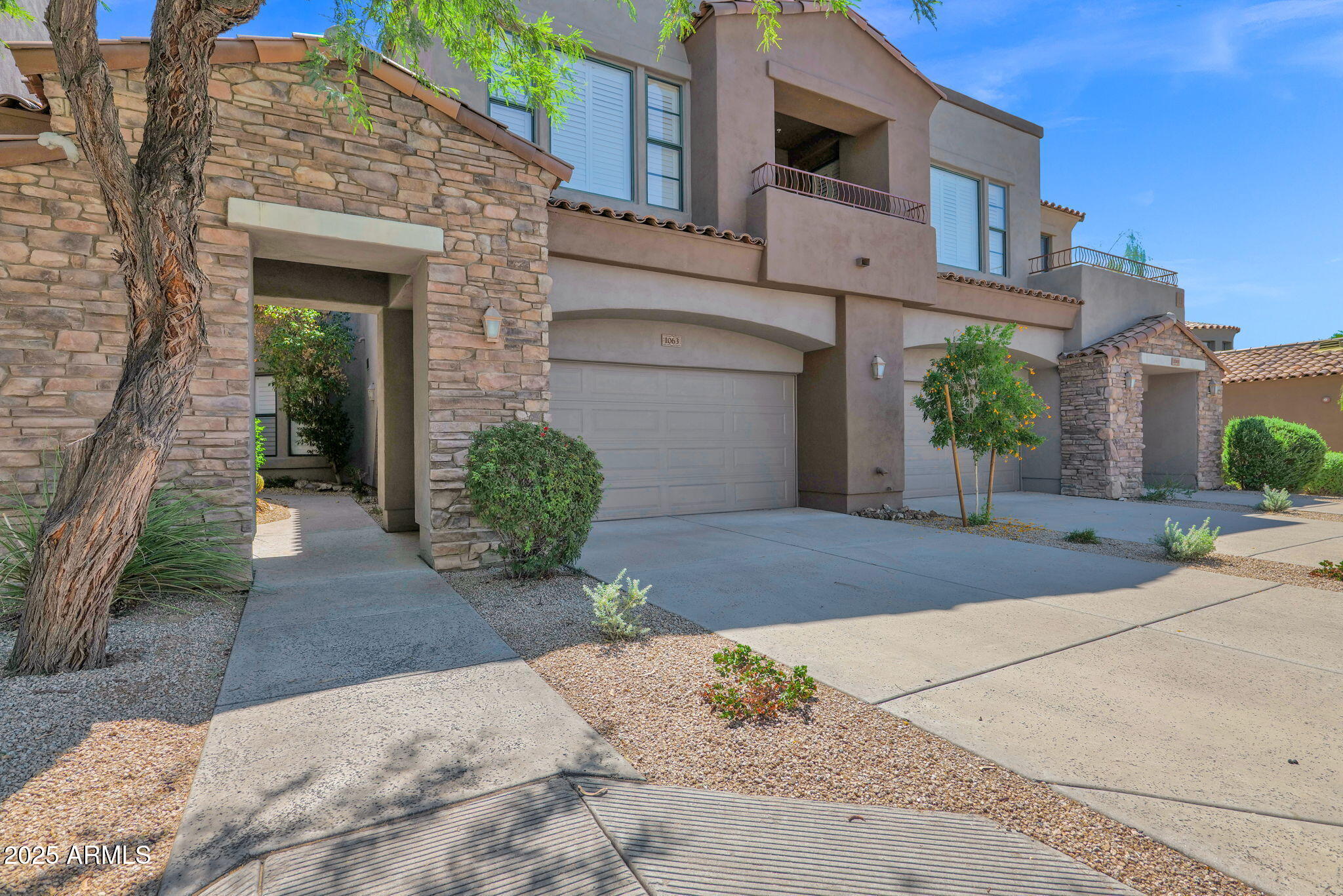 19550 North Grayhawk Drive, Unit 1063 Scottsdale, AZ 85255 - Photo 40 of 40 a view of a house with potted plants