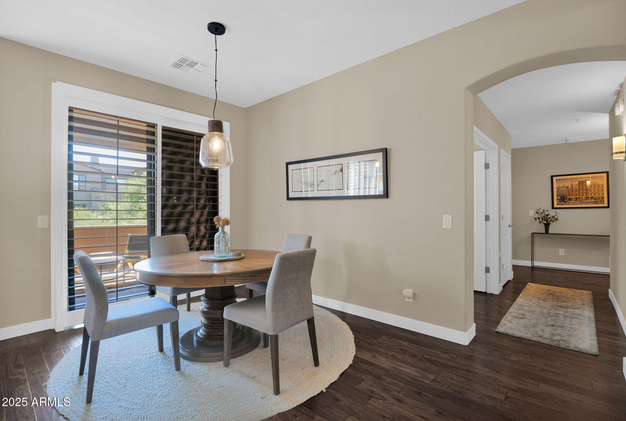 19550 North Grayhawk Drive, Unit 1063 Scottsdale, AZ 85255 - Photo 5 of 40 a view of a dining room with furniture window and wooden floor