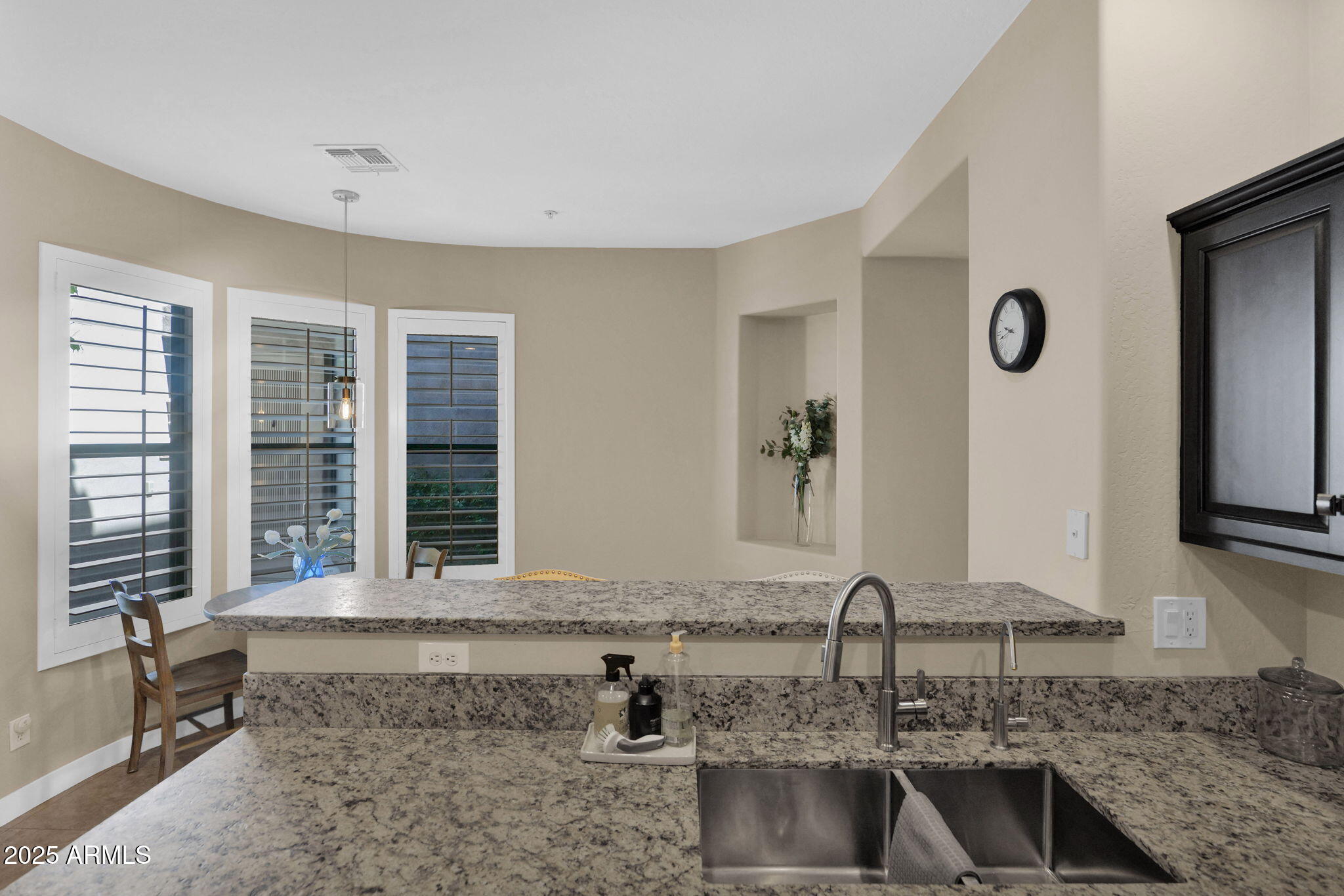 19550 North Grayhawk Drive, Unit 1063 Scottsdale, AZ 85255 - Photo 10 of 40 a bathroom with a granite countertop sink and a mirror