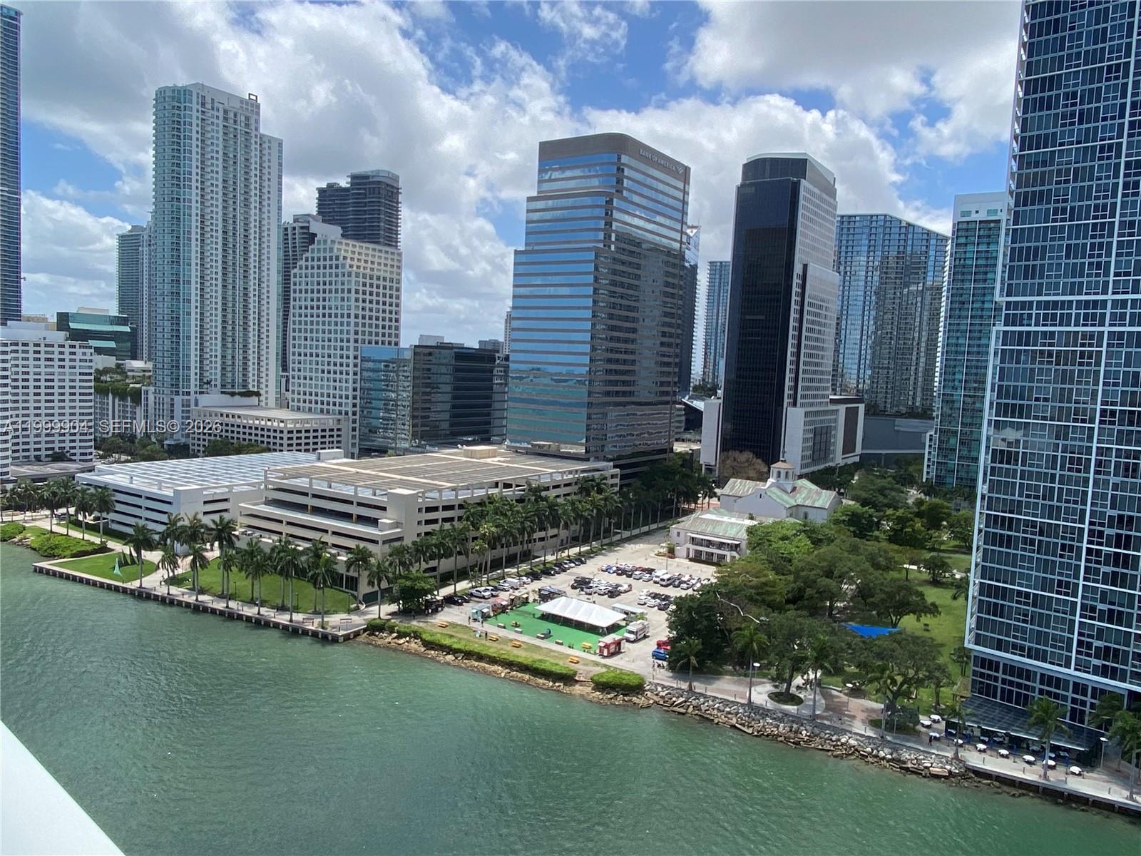701 Brickell Key Boulevard, Unit 2104 Miami, FL 33131 - Photo 12 of 13 a view of a house with swimming pool and sitting area
