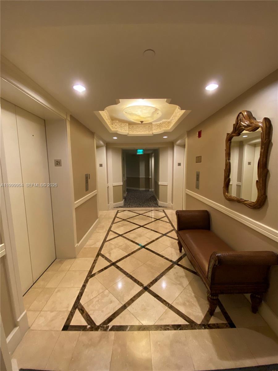 701 Brickell Key Boulevard, Unit 2104 Miami, FL 33131 - Photo 13 of 13 a room with gym equipment