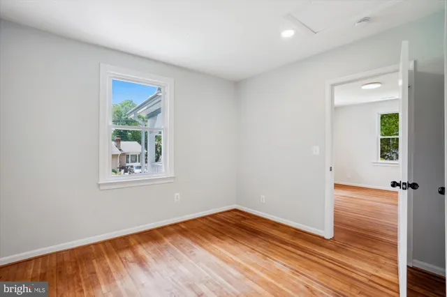 a view of bedroom with wooden floor