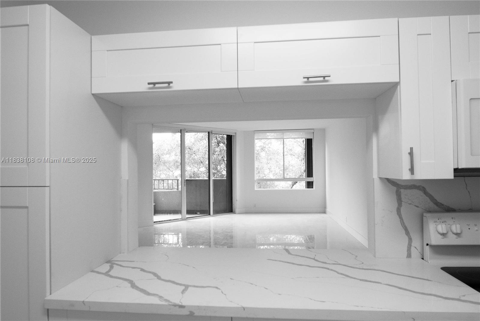 141 Crandon Boulevard, Unit 342 Key Biscayne, FL 33149 - Photo 12 of 25 a bedroom with a bed and a window