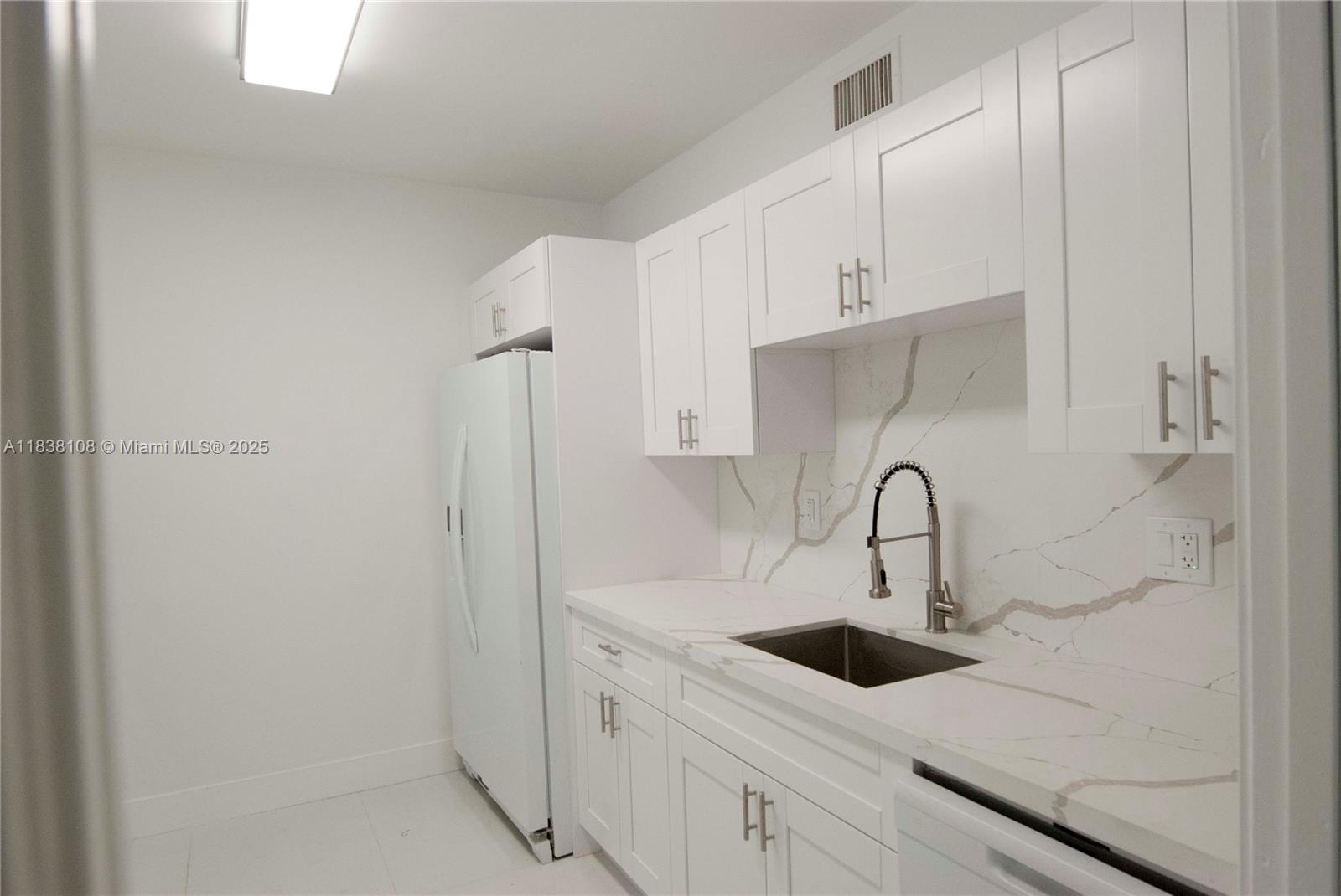 141 Crandon Boulevard, Unit 342 Key Biscayne, FL 33149 - Photo 14 of 25 a close view of a sink a counter space and cabinets