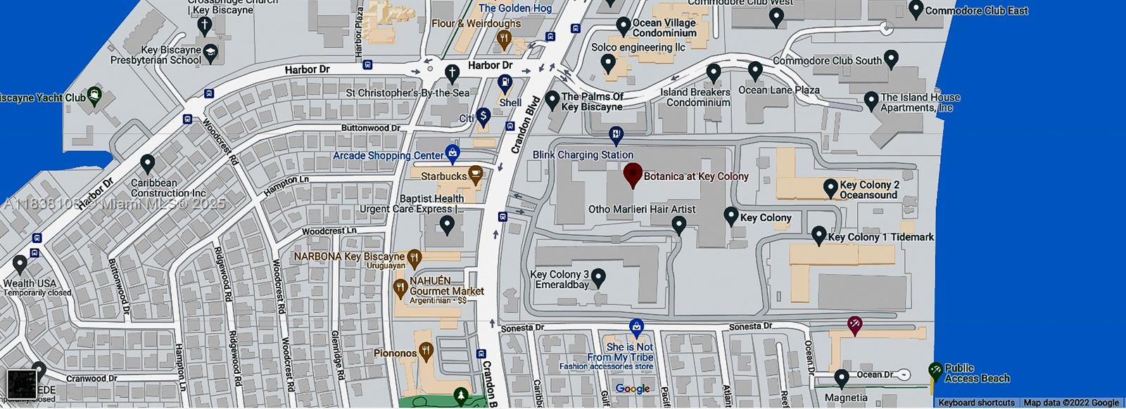 141 Crandon Boulevard, Unit 342 Key Biscayne, FL 33149 - Photo 25 of 25 a large building with a lot of cars on it