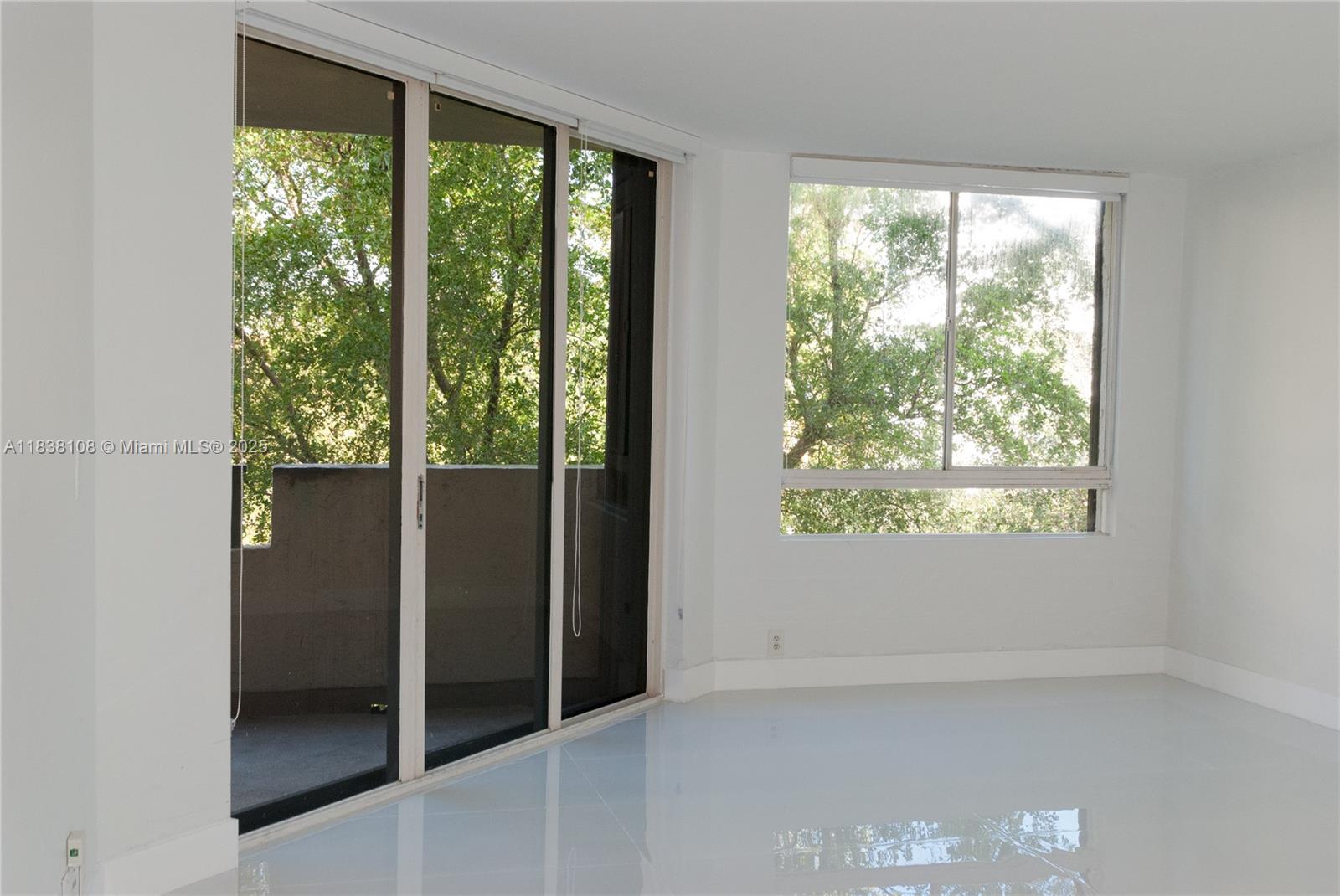 141 Crandon Boulevard, Unit 342 Key Biscayne, FL 33149 - Photo 3 of 25 a view of an empty room with a window