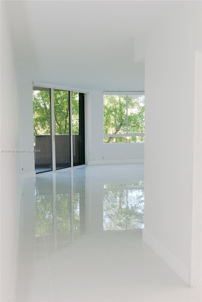 141 Crandon Boulevard, Unit 342 Key Biscayne, FL 33149 - Photo 4 of 25 a view of a room with a large window