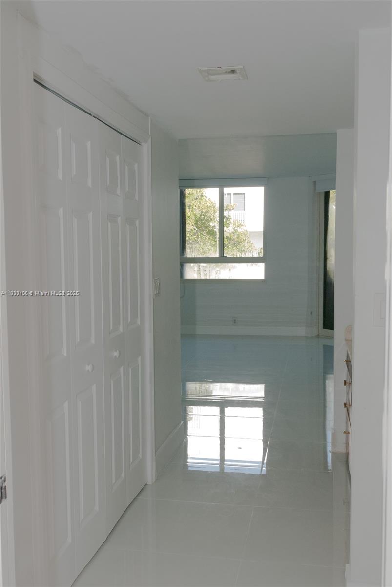 141 Crandon Boulevard, Unit 342 Key Biscayne, FL 33149 - Photo 6 of 25 a view of an empty room with a window